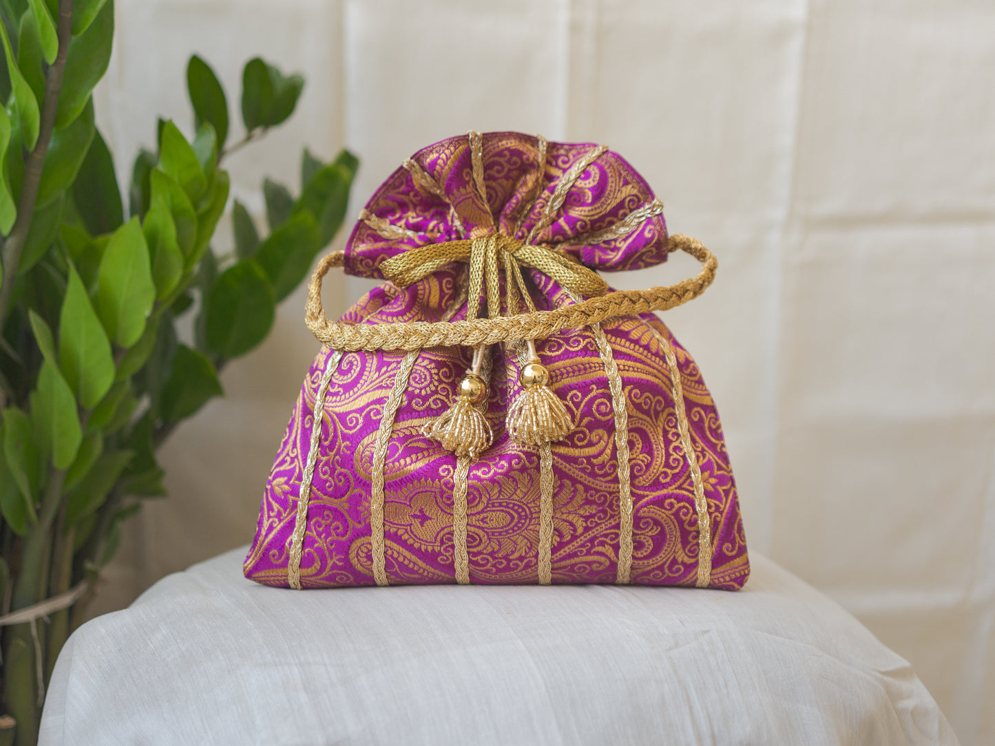 Purple & Golden Banarasi Potli With Glass Tassels