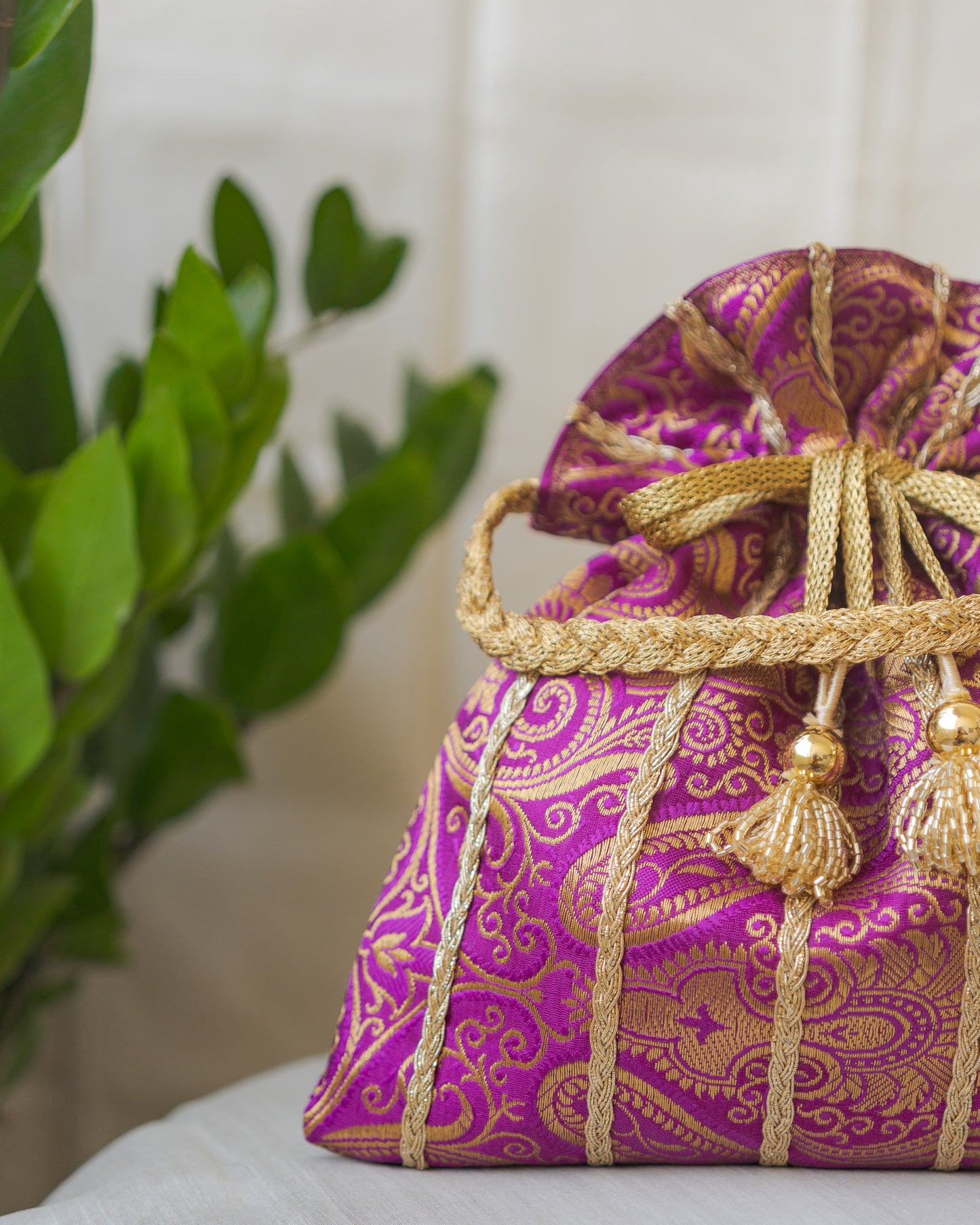 Purple & Golden Banarasi Potli With Glass Tassels
