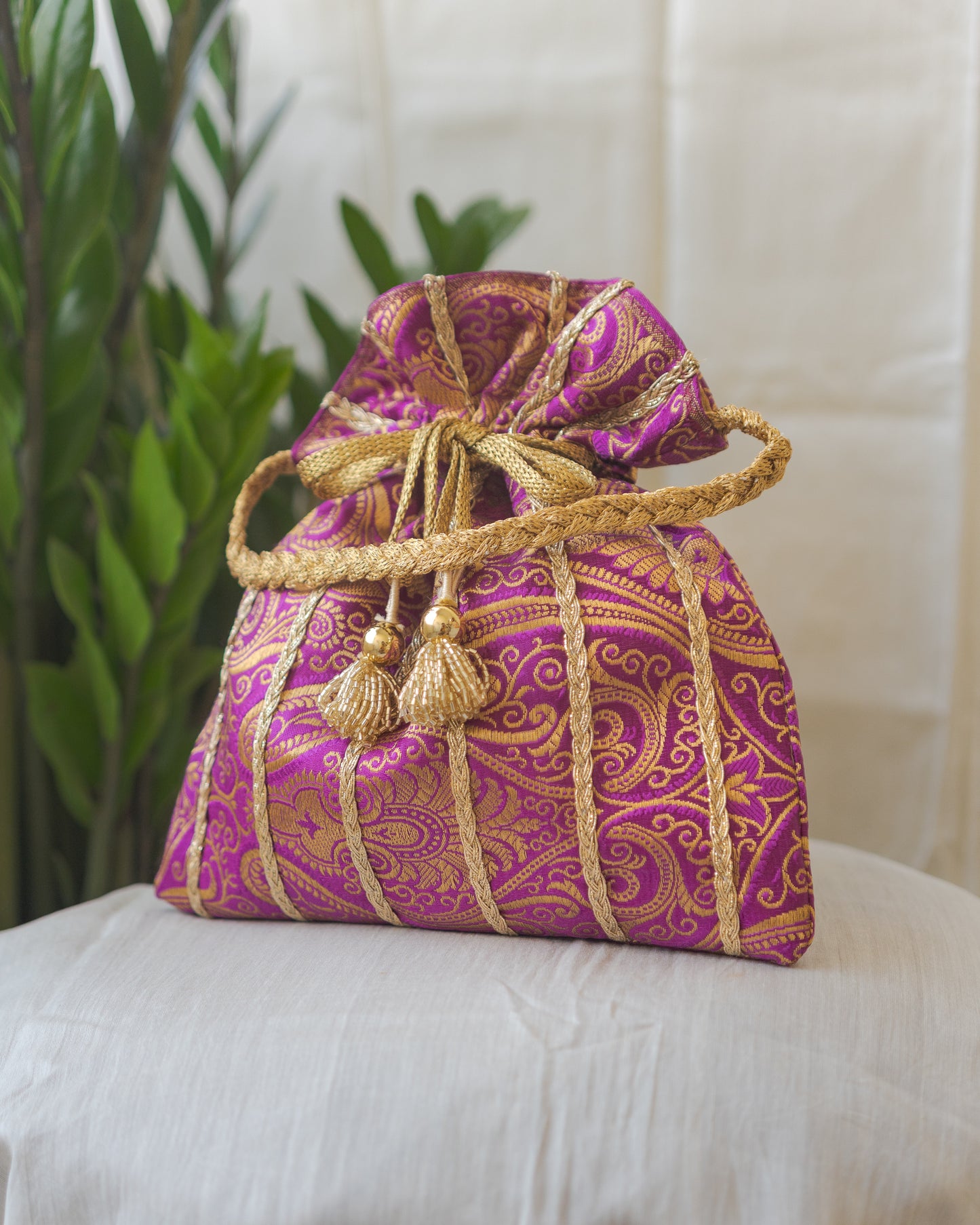 Purple & Golden Banarasi Potli With Glass Tassels