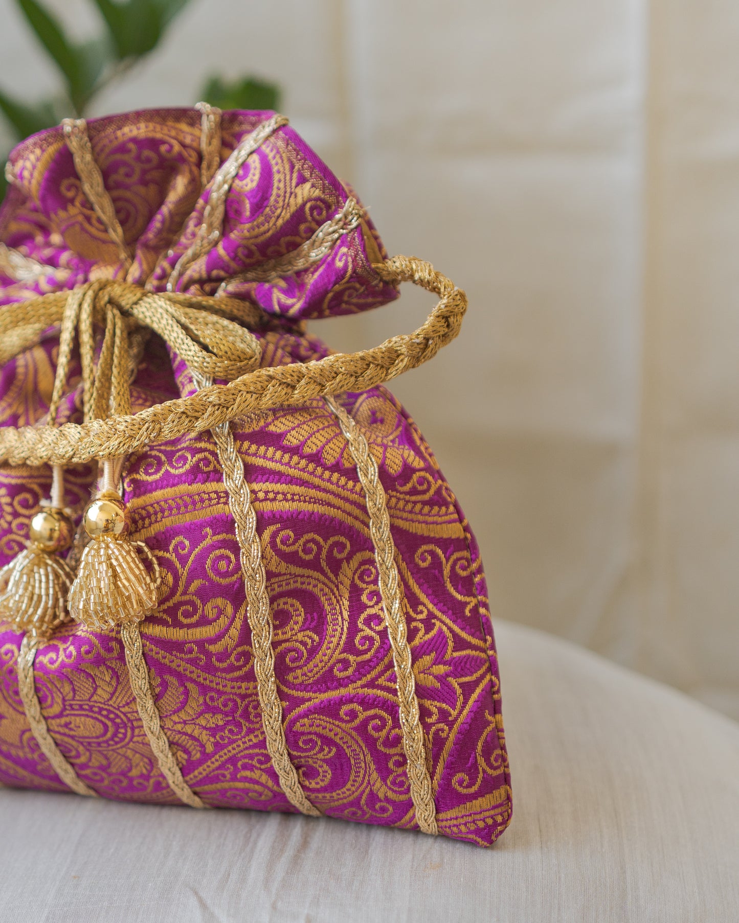 Purple & Golden Banarasi Potli With Glass Tassels