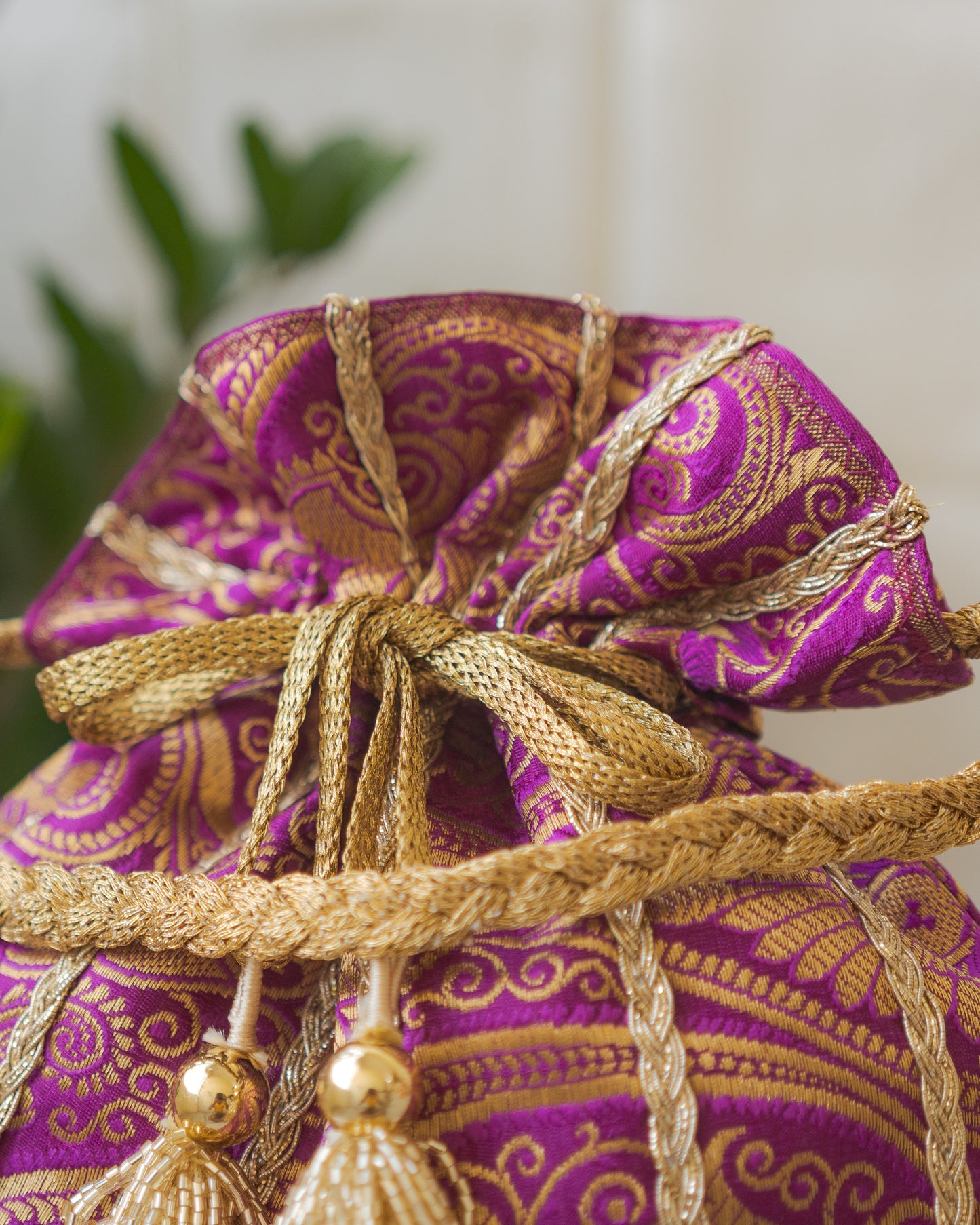 Purple & Golden Banarasi Potli With Glass Tassels