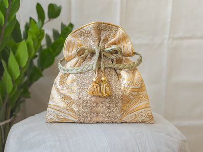 White & Golden Banarasi Potli With Broad Lace & Golden Glass Tassels