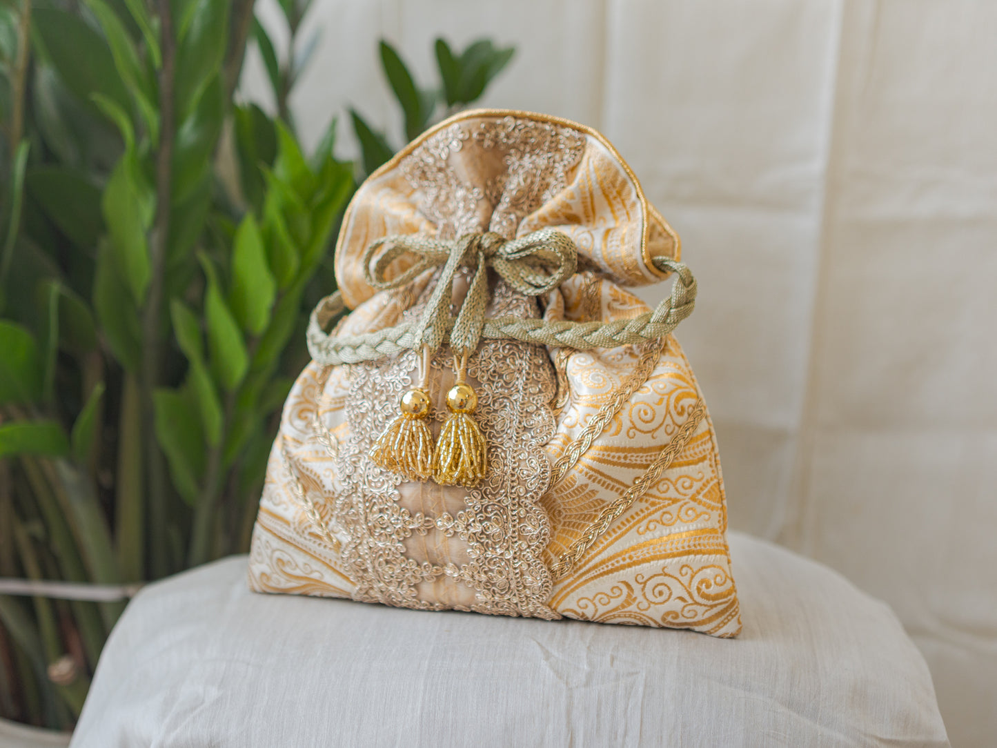 White & Golden Banarasi Potli With Broad Lace & Golden Glass Tassels