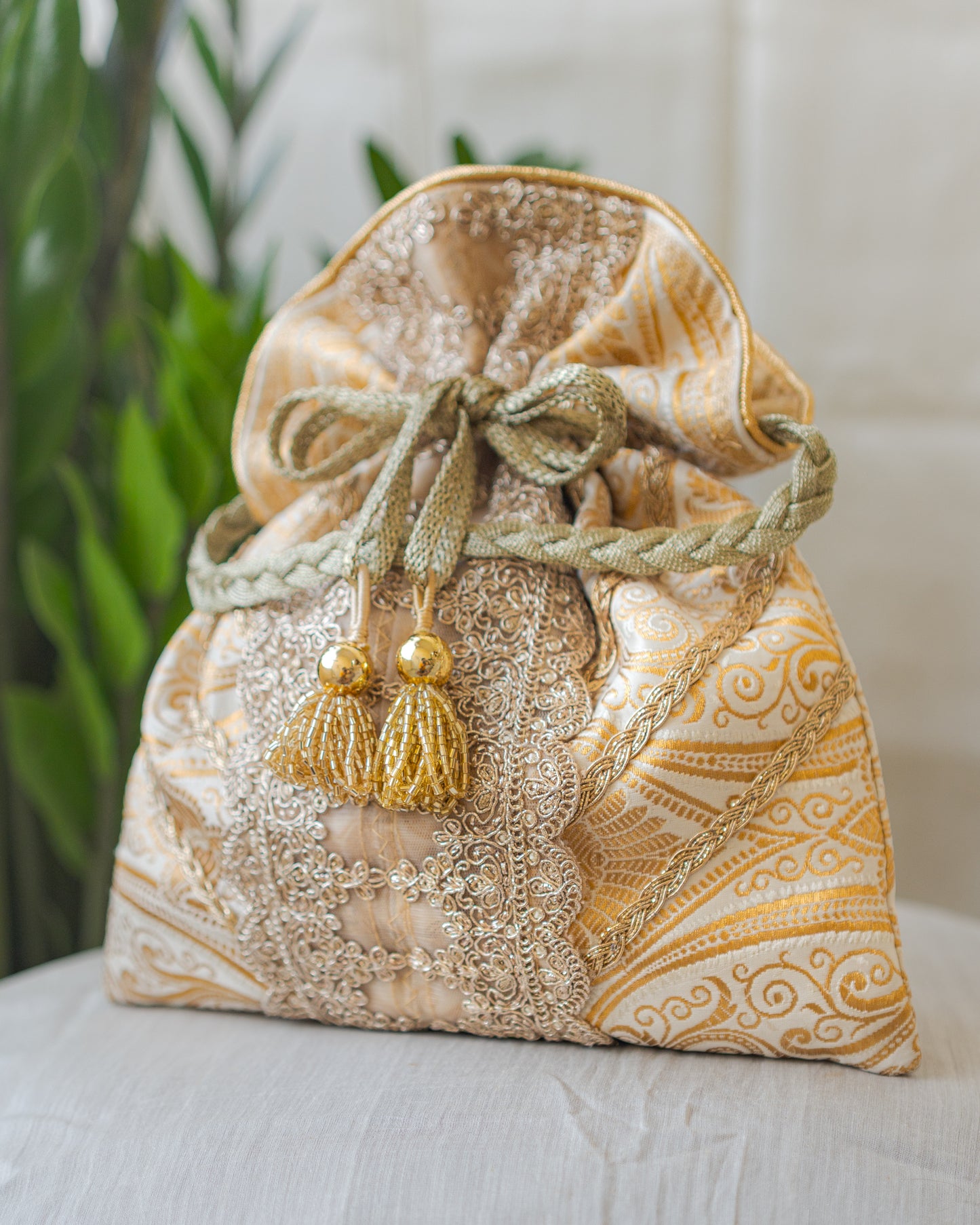 White & Golden Banarasi Potli With Broad Lace & Golden Glass Tassels