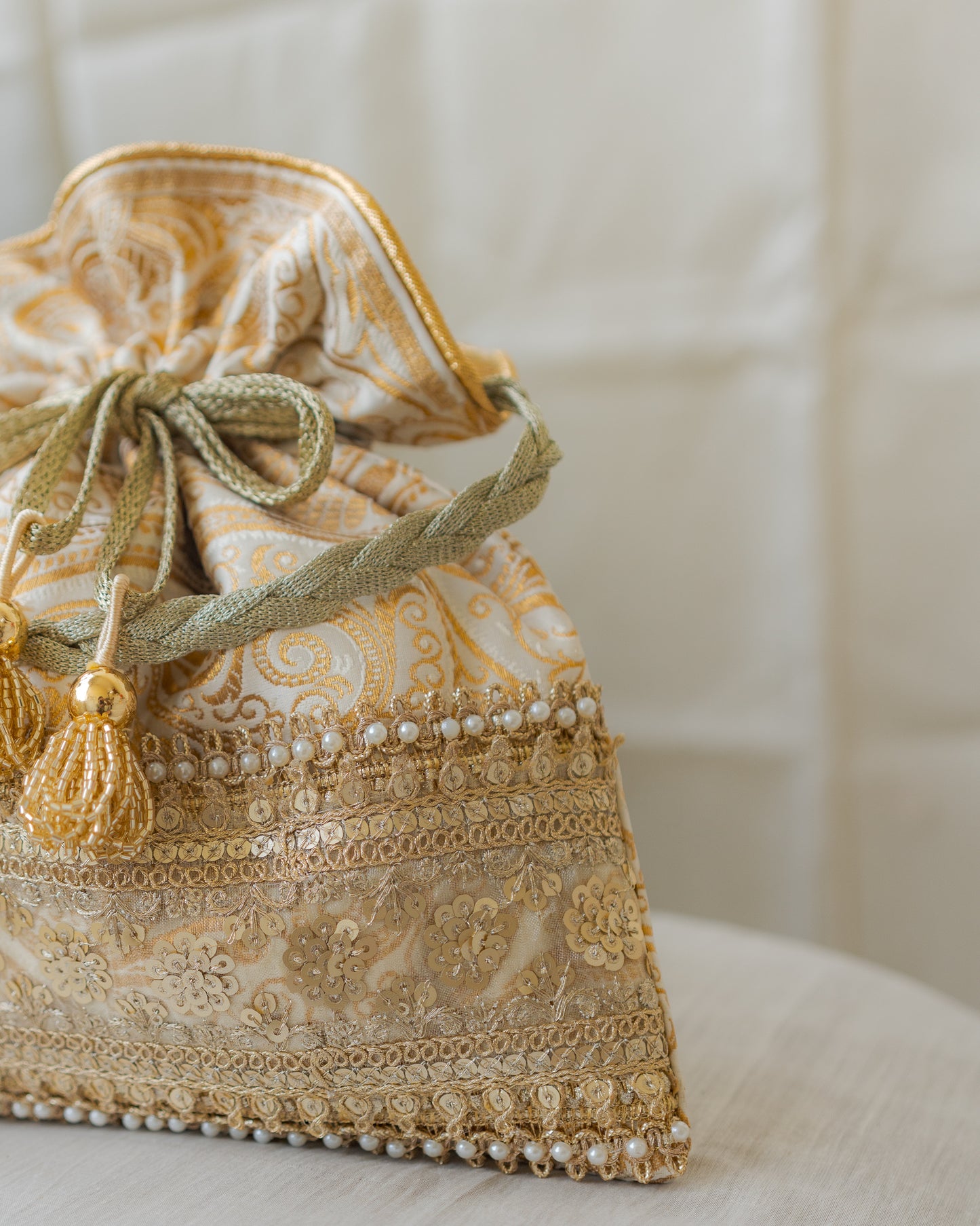 Royal White & Golden Banarasi Potli With Broad Sequin Pearl Lacework