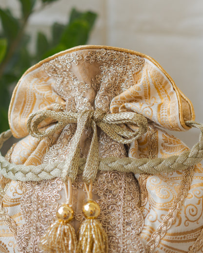 White & Golden Banarasi Potli With Broad Lace & Golden Glass Tassels