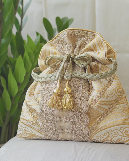 White & Golden Banarasi Potli With Broad Lace & Golden Glass Tassels